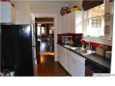 Kitchen is updated with granite and newer applianc