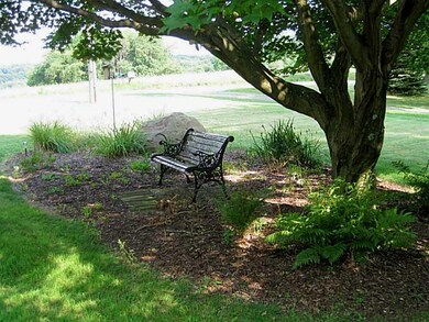 Exterior Front. Enjoy reading a book under the sha