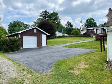 This view of the second garage, side yard, drivewa
