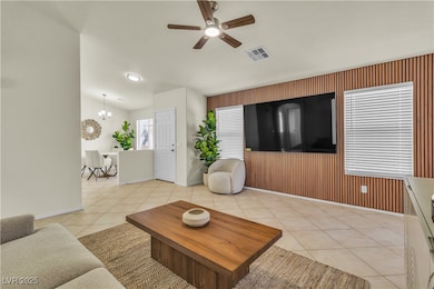 Living room featuring light tile patterned floors,