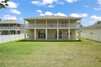 Rear of Home has dual patios overlooking the spaci