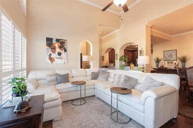 Living room featuring ornamental molding, a toweri