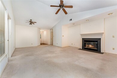 LR/DR with gas fireplace and cathedral ceiling