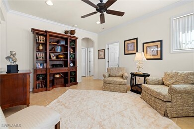 Tiled featuring crown molding, arched walkways, a