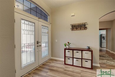 Enter into your foyer through leaded-glass double 