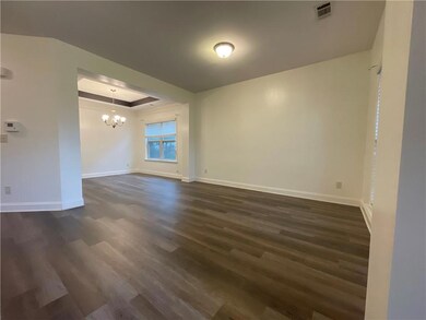 Unfurnished room with visible vents, baseboards, a