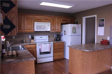 Looking into the kitchen again. You will have no problem entertaining in this open kitchen. Imagine all of the holiday meals you could serve on that large bar style counter. 