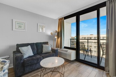 Living area featuring a wall mounted AC, wood fini