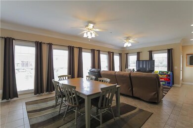 Angled view of extensive Florida room-natural light galore. Unique double sided fireplace. Custom blinds were added throughout.