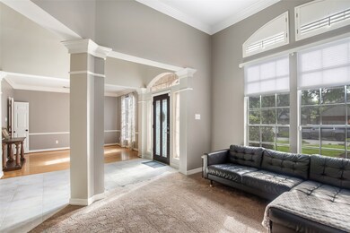 Elegant front office space with high ceilings, nat