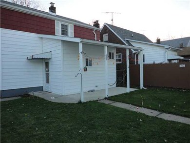 Exterior Front Fully fenced yard with open porch