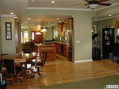 view from family room through open kitchen to dini