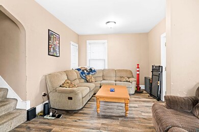 Living room featuring stairs and wood finished flo