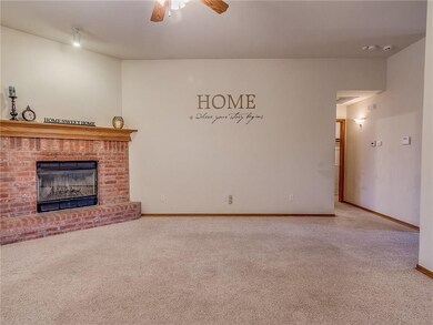 Large open living area with Brick fireplace that h