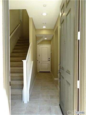 First floor /Front door view: Direct access to gar