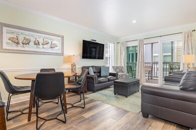 Living room with hardwood / wood-style flooring an