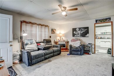 Living room features ventless gas fireplace on thermostat that heats the whole house.