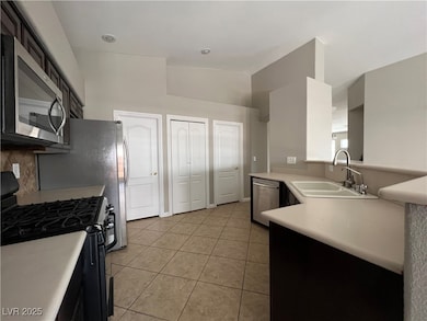 Kitchen with stainless steel appliances, light til