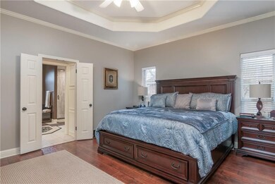 The master bedroom with its luscious wood floor an