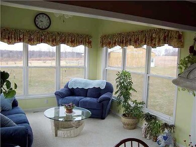 Other. Sun drenched room offers wall of windows an