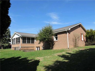 Exterior Back. Screened-in back porch and walk-out