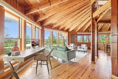 Living room featuring wooden ceiling, wooden wall