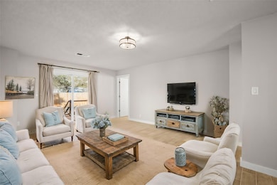 Living area with wood finished floors and baseboa