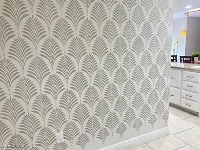 Bathroom with vanity, tile patterned flooring, and