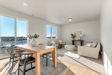 PHOTOS OF A SIMILAR HOME. COLORS, OPTIONS, AND FEATURES WILL VARY. Dining room with light wood-type flooring and recessed lighting