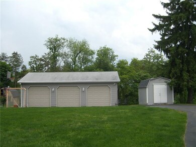 Huge detached garage and shed area for all you veh