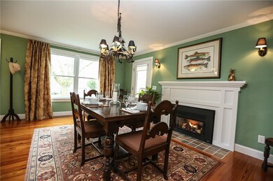 Elegant dining room with gas fireplace.