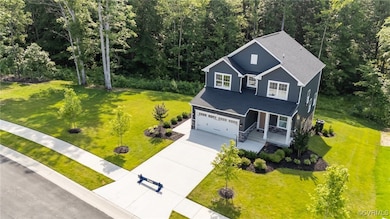 View of front of house with concrete driveway, cov