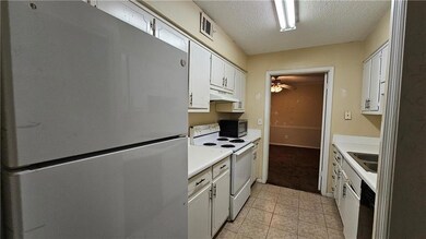 Kitchen featuring stainless steel appliances, ligh