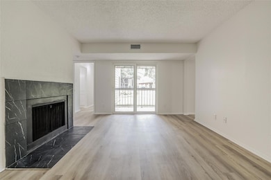 Unfurnished living room with a textured ceiling, 