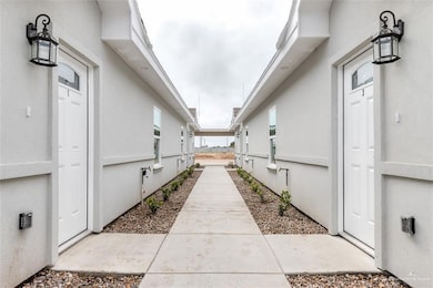 View of side of property featuring stucco siding