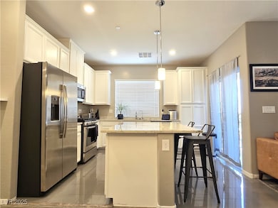 Kitchen featuring appliances with stainless steel