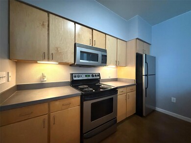 Kitchen featuring appliances with stainless steel