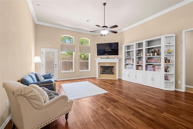Living area featuring wood finished floors, visib