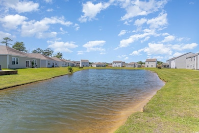Water view with nearby suburban area
