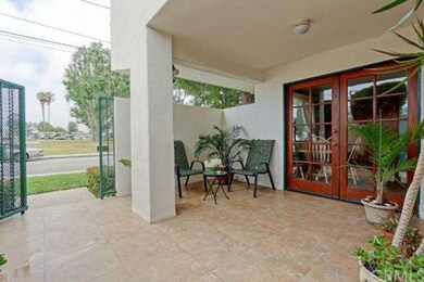 Private tiled patio with beautiful doors.