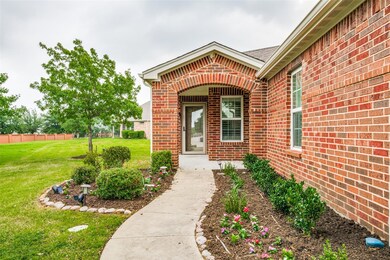 Walking up to the front door, landscaping renewed