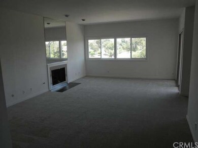 Large Living Room with fire place, balcony and gol