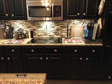 Granite counter tops + Stainless Steel Appl.