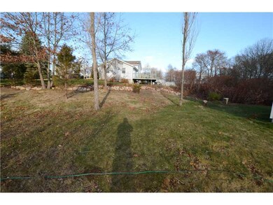 Land. Side view of house. Two trees recently takie