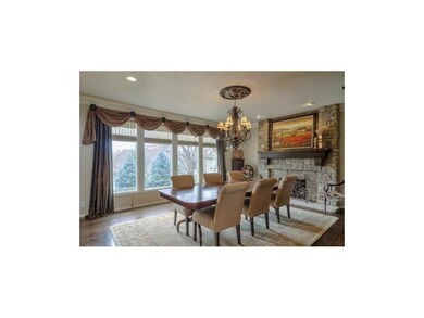 Huge dining room with custom stone fireplace overl