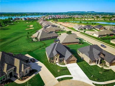 Drone / aerial view featuring a residential view, golf course view, and a water view