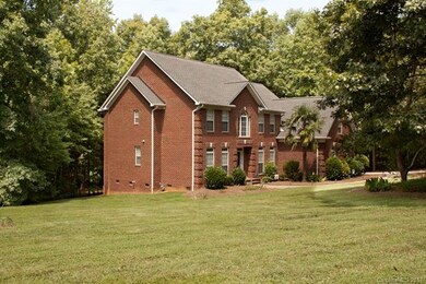 Full brick home, partially wooded 1.5 acre lot.