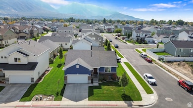 Aerial view of residential area featuring a mountain backdrop