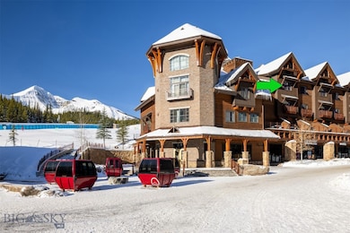 Snow covered building featuring a mountain view