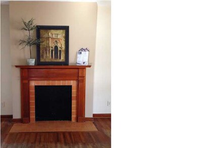 Nice decorative fireplace adorns the living room.